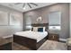 Elegant primary bedroom showcasing a plush bed, stylish decor, and ample natural light at 748 Desert Mountain Ct, Reunion, FL 34747
