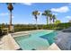 Beautiful backyard pool and spa surrounded by lush landscaping and palm trees at 748 Desert Mountain Ct, Reunion, FL 34747
