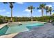 Beautiful backyard pool and spa surrounded by lush landscaping and palm trees at 748 Desert Mountain Ct, Reunion, FL 34747