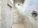 Elegant shower with white marble-style tile walls and ceiling rain shower head at 748 Desert Mountain Ct, Reunion, FL 34747