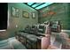 Cozy theater room with plush seating and a projector for entertainment at 748 Desert Mountain Ct, Reunion, FL 34747