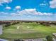 A picturesque golf course with expansive green fairways and clear blue skies at 7652 Whisper Way # 301, Reunion, FL 34747