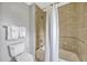 Bathroom featuring a tiled shower and tub combination with a white shower curtain at 7652 Whisper Way # 301, Reunion, FL 34747