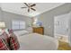 This bedroom offers two beds, a dresser with a TV and a door to a bathroom at 7652 Whisper Way # 301, Reunion, FL 34747
