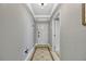 Foyer with tiled flooring, crown molding, and view into another room at 7652 Whisper Way # 301, Reunion, FL 34747