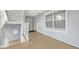 Hallway with stairs, white railings, and a large window for natural light at 7652 Whisper Way # 301, Reunion, FL 34747