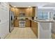 Spacious kitchen with stainless steel appliances and a breakfast bar overlooking the living room at 7652 Whisper Way # 301, Reunion, FL 34747