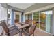 Outdoor patio with comfortable seating and sliding doors leading to the interior at 7652 Whisper Way # 301, Reunion, FL 34747