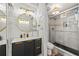Modern bathroom features dual sinks, stylish lighting, and walk-in shower at 800 N Atlantic Ave # 417, Daytona Beach, FL 32118