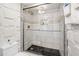 Updated bathroom with walk-in shower, glass door, and modern finishes at 800 N Atlantic Ave # 417, Daytona Beach, FL 32118