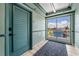 Hallway featuring a secure entrance door and a sliding glass door that provides plenty of natural light and views of the outdoors at 800 N Atlantic Ave # 417, Daytona Beach, FL 32118