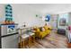 Cozy living area featuring seating, a mini fridge, and a view of the outdoors, ideal for relaxing or entertaining at 800 N Atlantic Ave # 417, Daytona Beach, FL 32118