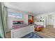 Open-concept living area features a bed, pull-out bed, and kitchenette at 800 N Atlantic Ave # 417, Daytona Beach, FL 32118