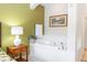 Bathroom featuring a garden tub with tile surround, decorative art, and a vanity at 8100 Poinciana Blvd # 2109, Orlando, FL 32821
