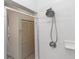 Bathroom featuring a rain shower head and glass shower doors at 8100 Poinciana Blvd # 2109, Orlando, FL 32821