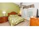 Bedroom featuring a ceiling fan and tropical bedding at 8100 Poinciana Blvd # 2109, Orlando, FL 32821