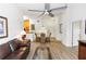 Open-concept living area showcasing wood-look floors with a dining space and offering views of other living areas at 8100 Poinciana Blvd # 2109, Orlando, FL 32821