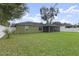 Spacious backyard with lush green grass and privacy fence, perfect for outdoor activities and relaxation at 817 Benton Lake S Dr, Deland, FL 32724