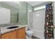 Bathroom featuring shower, granite countertop, shower curtain, and neutral walls, offering a refreshing space at 817 Benton Lake S Dr, Deland, FL 32724