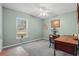 Bedroom featuring carpet flooring, ceiling fan, and a bright window providing natural light, offering a relaxing space at 817 Benton Lake S Dr, Deland, FL 32724
