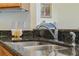 Granite countertops are highlighted with stainless steel faucet and under-mount sink at 817 Benton Lake S Dr, Deland, FL 32724