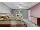 Spacious main bedroom featuring neutral walls, ceiling fan, carpeted floors and a patio at 817 Benton Lake S Dr, Deland, FL 32724
