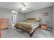 Spacious main bedroom featuring neutral walls, ceiling fan and carpeted floors at 817 Benton Lake S Dr, Deland, FL 32724