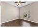Well-lit bedroom featuring hardwood floors, neutral walls, and a window for ample natural light at 902 Wingate Trl, Port Orange, FL 32128