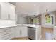 Bright eat in kitchen featuring white cabinets, stainless steel appliances, and quartz countertops at 902 Wingate Trl, Port Orange, FL 32128