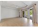 Spacious living room with tray ceilings and sliding glass doors to a backyard patio at 902 Wingate Trl, Port Orange, FL 32128