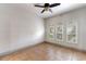 Bright, empty living room with tile flooring, three arched windows and neutral paint, ready for personalization at 902 Wingate Trl, Port Orange, FL 32128