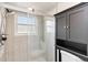 This bathroom features a glass shower door with a built-in vanity and granite countertops at 9338 Palm Tree Dr, Windermere, FL 34786