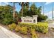 Silver Woods neighborhood sign surrounded by lush landscaping, indicating a well-maintained community at 9338 Palm Tree Dr, Windermere, FL 34786