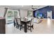 Open-concept dining room with direct access to the pool, integrated with the living room space at 9338 Palm Tree Dr, Windermere, FL 34786