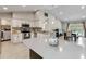 Open kitchen with granite countertops, island seating, and stainless steel appliances at 9338 Palm Tree Dr, Windermere, FL 34786