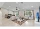 Bright, open-concept living room with tile floors, recessed lighting, and contemporary furnishings at 9338 Palm Tree Dr, Windermere, FL 34786
