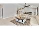 Spacious living room featuring tile floors, neutral decor, and an open layout perfect for entertaining at 9338 Palm Tree Dr, Windermere, FL 34786