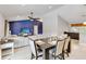Open-concept living area with modern decor, dining table, and comfortable seating at 9338 Palm Tree Dr, Windermere, FL 34786