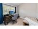 Comfortable home office with a large window, desk, chair, and daybed at 9338 Palm Tree Dr, Windermere, FL 34786