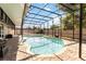 Sparkling pool with screened enclosure, surrounded by brick pavers and a privacy fence for outdoor enjoyment at 9338 Palm Tree Dr, Windermere, FL 34786