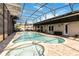 Relax by the crystal clear pool featuring a screened enclosure for year-round enjoyment and privacy at 9338 Palm Tree Dr, Windermere, FL 34786