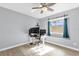 Minimalist-style bedroom with a desk and a window view of the backyard at 1004 Moccasin Run Rd, Oviedo, FL 32765