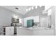 Bright kitchen with modern appliances, a marble island, and stylish pendant lighting at 1004 Moccasin Run Rd, Oviedo, FL 32765