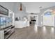 Open-concept living area with hardwood floors, neutral paint, and lots of natural light at 1004 Moccasin Run Rd, Oviedo, FL 32765