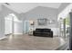 Bright living room featuring hardwood floors, a comfortable couch, and a glass sliding door at 1004 Moccasin Run Rd, Oviedo, FL 32765