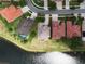 Aerial view showcasing property lines of a home with lake access and lush green surroundings at 1027 Algare Loop, Windermere, FL 34786