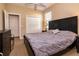 Bedroom with gray bedding, closet, and beige walls provides lots of natural light at 1027 Algare Loop, Windermere, FL 34786