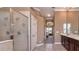 Bright bathroom with walk-in shower, and access to the main bedroom with double vanity at 1027 Algare Loop, Windermere, FL 34786