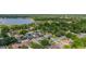 A high angle of the neighborhood with a large lake in the background at 1034 Featherstone Cir, Ocoee, FL 34761