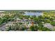 An elevated angle of the neighborhood with a large lake in the background at 1034 Featherstone Cir, Ocoee, FL 34761